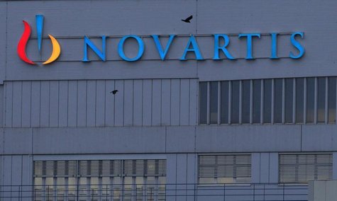 A logo is pictured on a building of Swiss drug maker Novartis before its annual general meeting in Pratteln near Basel February 22, 2013. RE A logo is pictured on a building of Swiss drug maker Novartis before its annual general meeting in Pratteln near Basel February 22, 2013. RE