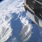 The island of Cyprus is partially visible among the clouds with the European Space Agency's Columbus module in the foreground in this image The island of Cyprus is partially visible among the clouds with the European Space Agency's Columbus module in the foreground in this image