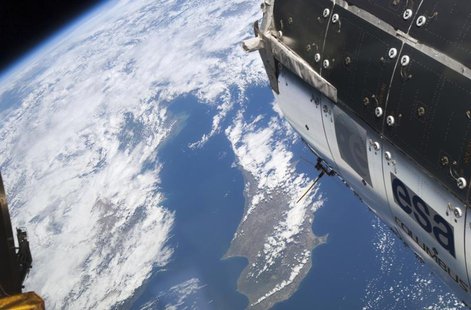 The island of Cyprus is partially visible among the clouds with the European Space Agency's Columbus module in the foreground in this image The island of Cyprus is partially visible among the clouds with the European Space Agency's Columbus module in the foreground in this image