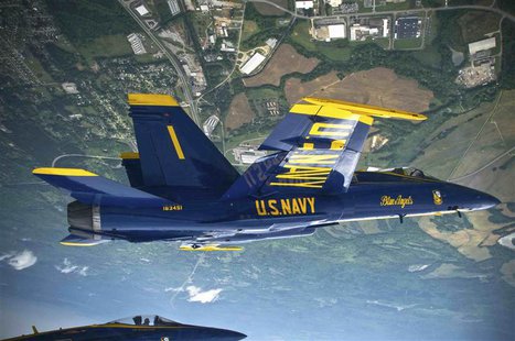 Capt. Greg McWherter, commanding officer and flight leader for the U.S. Navy flight demonstration squadron of the Blue Angels, leads a forma Capt. Greg McWherter, commanding officer and flight leader for the U.S. Navy flight demonstration squadron of the Blue Angels, leads a forma