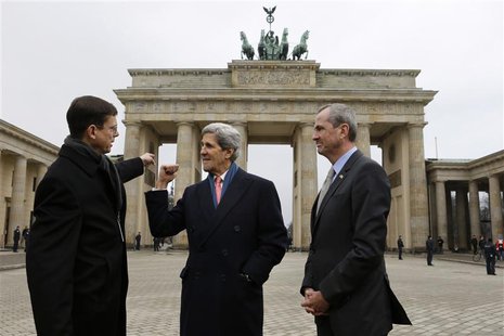 Walter Hassmann, deputy chief of Protocol for the German Foreign Ministry (L), talks with U.S. Secretary of State John Kerry and U.S. Ambass Walter Hassmann, deputy chief of Protocol for the German Foreign Ministry (L), talks with U.S. Secretary of State John Kerry and U.S. Ambass