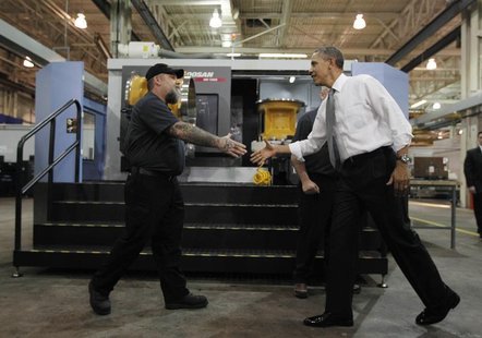 U.S. President Barack Obama meets workers as he tours Linamar Corporation, a manufacturer of parts for the truck industry in Arden, North Ca U.S. President Barack Obama meets workers as he tours Linamar Corporation, a manufacturer of parts for the truck industry in Arden, North Ca