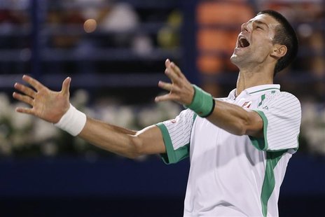 Novak Djokovic of Serbia reacts after winning his men's singles semi-final match against Juan Martin Del Potro of Argentina during the ATP D Novak Djokovic of Serbia reacts after winning his men's singles semi-final match against Juan Martin Del Potro of Argentina during the ATP D