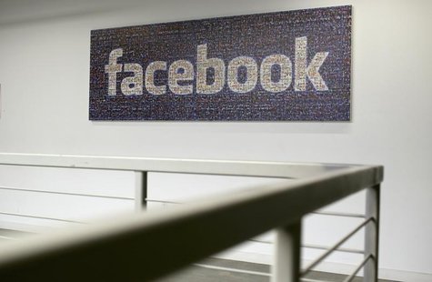 The Facebook logo is pictured in the Facebook headquarters in Menlo Park, California January 29, 2013. REUTERS/Robert Galbraith The Facebook logo is pictured in the Facebook headquarters in Menlo Park, California January 29, 2013. REUTERS/Robert Galbraith