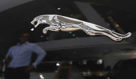 A man is reflected in the logo of a Jaguar vehicle at a Jaguar Land Rover showroom in Mumbai February 13, 2013. REUTERS/Vivek Prakash A man is reflected in the logo of a Jaguar vehicle at a Jaguar Land Rover showroom in Mumbai February 13, 2013. REUTERS/Vivek Prakash
