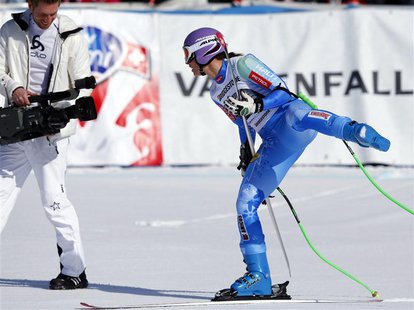 Slovenia's Tina Maze celebrates in front of a cameraman after the women's Alpine Skiing World Cup Downhill race in Garmisch-Partenkirchen Ma Slovenia's Tina Maze celebrates in front of a cameraman after the women's Alpine Skiing World Cup Downhill race in Garmisch-Partenkirchen Ma