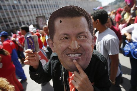 A supporter of Venezuela's President Hugo Chavez wears a mask depicting him during a rally in Caracas February 27, 2013. REUTERS/Jorgre Silv A supporter of Venezuela's President Hugo Chavez wears a mask depicting him during a rally in Caracas February 27, 2013. REUTERS/Jorgre Silv