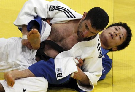 Japan's Junpei Morishita (R) challenges Armenia's Armen Nazaryan in their under-66 kg final at the Paris International grand slam judo tourn Japan's Junpei Morishita (R) challenges Armenia's Armen Nazaryan in their under-66 kg final at the Paris International grand slam judo tourn