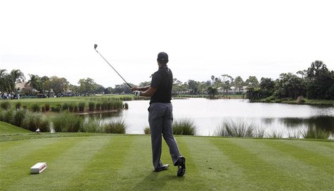 Tiger Woods of the U.S. follows through on a tee shot on the 13th hole during the third round play at the Honda Classic PGA golf tournament Tiger Woods of the U.S. follows through on a tee shot on the 13th hole during the third round play at the Honda Classic PGA golf tournament
