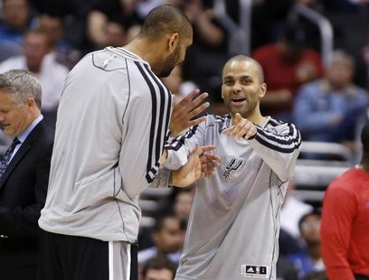 San Antonio Spurs' Tony Parker (R), of France, and Tim Duncan share a laugh against the Los Angeles Clippers during the second half of an NB San Antonio Spurs' Tony Parker (R), of France, and Tim Duncan share a laugh against the Los Angeles Clippers during the second half of an NB