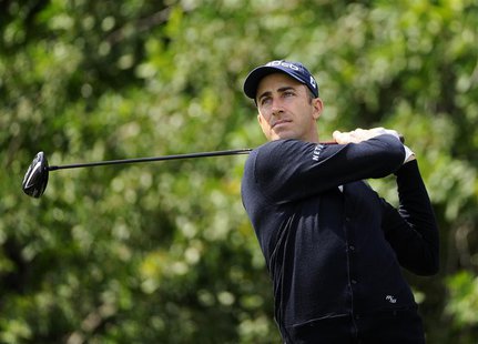 Geoff Ogilvy of Australia hits his tee shot on the 3rd hole during the third round of play in the Honda Classic PGA golf tournament in Palm Geoff Ogilvy of Australia hits his tee shot on the 3rd hole during the third round of play in the Honda Classic PGA golf tournament in Palm