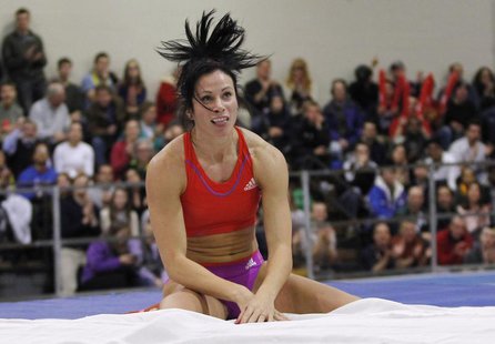 Jenn Suhr of the U.S. reacts after clearing the bar as she competes in the women's pole vault during the New Balance Indoor Grand Prix track Jenn Suhr of the U.S. reacts after clearing the bar as she competes in the women's pole vault during the New Balance Indoor Grand Prix track