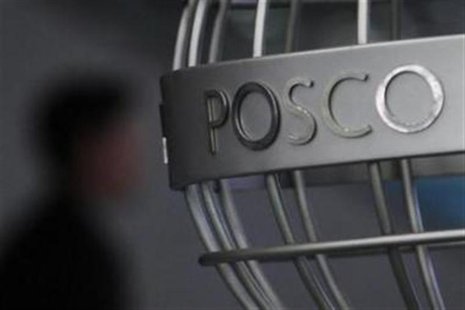 A man walks past a POSCO logo at the company's headquarters in Seoul April 22, 2011. REUTERS/Truth Leem/Files A man walks past a POSCO logo at the company's headquarters in Seoul April 22, 2011. REUTERS/Truth Leem/Files