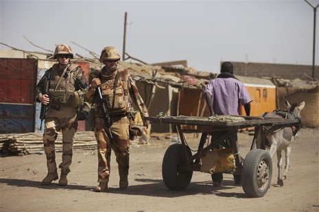 French soldiers pass a donkey-driven cart outside the destroyed main market in Gao, March 2, 2013. REUTERS/Joe Penney French soldiers pass a donkey-driven cart outside the destroyed main market in Gao, March 2, 2013. REUTERS/Joe Penney