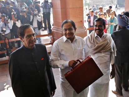 India's Finance Minister Palaniappan Chidambaram (C) arrives at the parliament to present the 2013/14 federal budget in New Delhi February 2 India's Finance Minister Palaniappan Chidambaram (C) arrives at the parliament to present the 2013/14 federal budget in New Delhi February 2