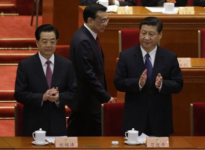 China's President Hu Jintao and China's Communist Party Chief Xi Jinping clap as China's Vice President Li Keqiang walks past before the ope China's President Hu Jintao and China's Communist Party Chief Xi Jinping clap as China's Vice President Li Keqiang walks past before the ope