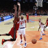 Miami Heat center Chris Bosh reacts after scoring against New York Knicks center Tyson Chandler (6) and guard J.R. Smith (R) in the fourth q Miami Heat center Chris Bosh reacts after scoring against New York Knicks center Tyson Chandler (6) and guard J.R. Smith (R) in the fourth q