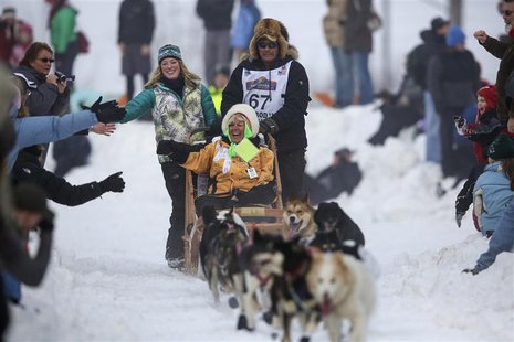 Sonny Lindner's team races down Cordova Street during the ceremonial start to the Iditarod dog sled race in downtown Anchorage, Alaska March Sonny Lindner's team races down Cordova Street during the ceremonial start to the Iditarod dog sled race in downtown Anchorage, Alaska March