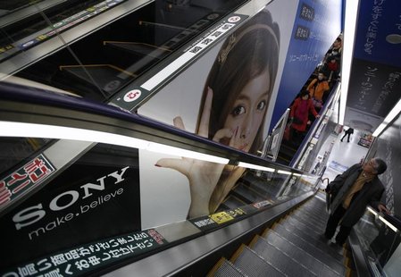 A man riding an escalator passes an advertisement of Sony Corp. at an electronic store in Tokyo February 6, 2013. REUTERS/Shohei Miyano A man riding an escalator passes an advertisement of Sony Corp. at an electronic store in Tokyo February 6, 2013. REUTERS/Shohei Miyano