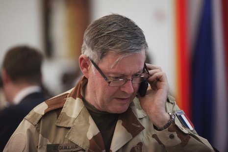 France's Chief of the Defence Staff Admiral Edouard Guillaud speaks on a mobile phone at the presidential palace in Bamako, Mali February 2, France's Chief of the Defence Staff Admiral Edouard Guillaud speaks on a mobile phone at the presidential palace in Bamako, Mali February 2,