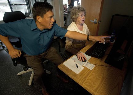 Cyber security analysts work to restore control over computers, lights, and defend a network during a drill at a Department of Homeland Secu Cyber security analysts work to restore control over computers, lights, and defend a network during a drill at a Department of Homeland Secu