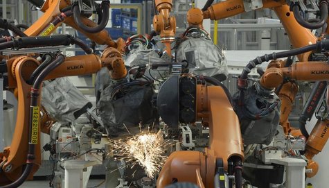 Welding robots are seen in a production line of the Golf VII car at the plant of German carmaker Volkswagen in Wolfsburg, February 25, 2013. Welding robots are seen in a production line of the Golf VII car at the plant of German carmaker Volkswagen in Wolfsburg, February 25, 2013.