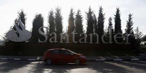A car drives past the logo of Spanish Santander bank in a roundabout outside the company's headquarters in Boadilla del Monte, outside Madri A car drives past the logo of Spanish Santander bank in a roundabout outside the company's headquarters in Boadilla del Monte, outside Madri