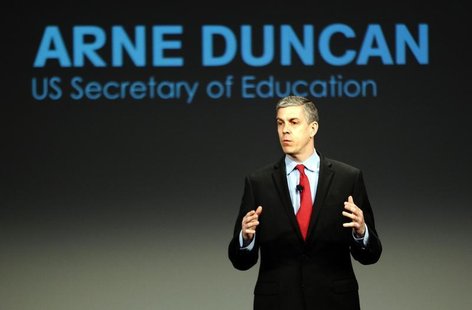 U.S. Secretary of Education Arne Duncan addresses a crowd of teachers and politicians during an event to bring physical activity back to sch U.S. Secretary of Education Arne Duncan addresses a crowd of teachers and politicians during an event to bring physical activity back to sch