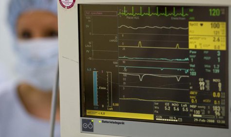 A surgery nurse is seen beside the heart beat monitor in the operating theatre of the Unfallkrankenhaus Berlin (UKB) hospital in Berlin Febr A surgery nurse is seen beside the heart beat monitor in the operating theatre of the Unfallkrankenhaus Berlin (UKB) hospital in Berlin Febr