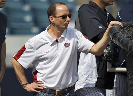New York Yankees' General Manager Brian Cashman watches batting practice during workouts at the team's spring training complex in Tampa, Flo New York Yankees' General Manager Brian Cashman watches batting practice during workouts at the team's spring training complex in Tampa, Flo