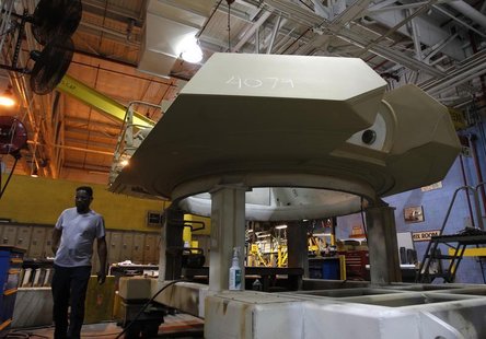 General Dynamics employees work on a gun turret for an Abrams battle tank during a tour of the Joint Systems Manufacturing Center, Lima Army General Dynamics employees work on a gun turret for an Abrams battle tank during a tour of the Joint Systems Manufacturing Center, Lima Army