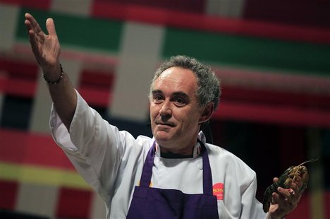 El Bulli restaurant head chef Ferran Adria gestures while holding a shrimp as he speaks during a conference at the "Mistura" gastronomic fai El Bulli restaurant head chef Ferran Adria gestures while holding a shrimp as he speaks during a conference at the "Mistura" gastronomic fai