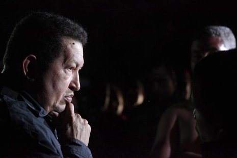 Venezuelan President Hugo Chavez listens to people affected by rains in Cumana August 24, 2012. REUTERS/Miraflores Palace/Handout Venezuelan President Hugo Chavez listens to people affected by rains in Cumana August 24, 2012. REUTERS/Miraflores Palace/Handout