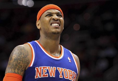 New York Knicks' Carmelo Anthony grimaces as he leaves the court after injuring himself when falling at midcourt during the second quarter o New York Knicks' Carmelo Anthony grimaces as he leaves the court after injuring himself when falling at midcourt during the second quarter o