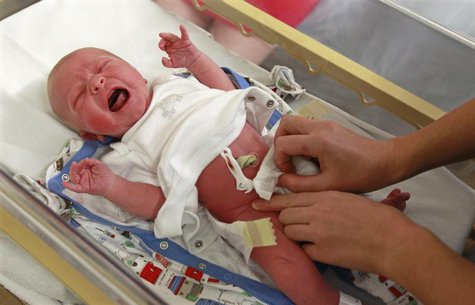 Newborn Alexander Rowland is examined by a paediatrician in the maternity ward at Hinchingbrooke Hospital in Huntingdon, eastern England Nov Newborn Alexander Rowland is examined by a paediatrician in the maternity ward at Hinchingbrooke Hospital in Huntingdon, eastern England Nov