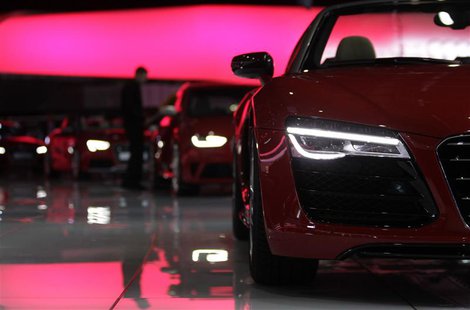 A staff cleans cars on the Audi stand ahead of the 83rd Geneva Car Show at the Palexpo Arena in Geneva March 4, 2013. The Geneva Motor Show A staff cleans cars on the Audi stand ahead of the 83rd Geneva Car Show at the Palexpo Arena in Geneva March 4, 2013. The Geneva Motor Show