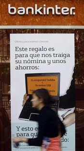 A woman walks past a Bankinter bank office branch in Madrid April 24, 2009. REUTERS/Susana Vera A woman walks past a Bankinter bank office branch in Madrid April 24, 2009. REUTERS/Susana Vera