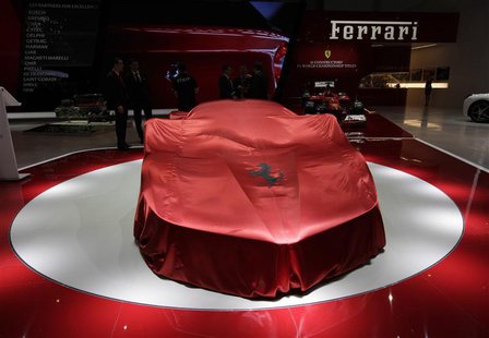 The new Ferrari car is covered on the stand during the first media day of the 83rd Geneva Car Show at the Palexpo Arena in Geneva March 5, 2 The new Ferrari car is covered on the stand during the first media day of the 83rd Geneva Car Show at the Palexpo Arena in Geneva March 5, 2