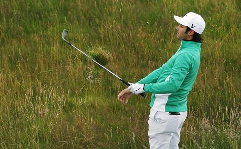 Andrew Georgiou of South Africa hits from the rough on the fourth hole during a practice round ahead of the British Open golf championship a Andrew Georgiou of South Africa hits from the rough on the fourth hole during a practice round ahead of the British Open golf championship a