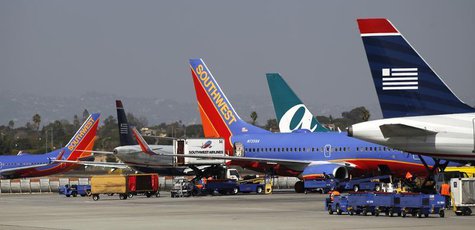 Airplanes are seen parked at Los Angeles International Airport in Los Angeles, California March 4, 2013. REUTERS/Mario Anzuoni Airplanes are seen parked at Los Angeles International Airport in Los Angeles, California March 4, 2013. REUTERS/Mario Anzuoni