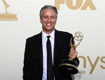 Television host Jon Stewart holds the Emmy award for the "The Daily Show With Jon Stewart" after winning for outstanding variety, music or c Television host Jon Stewart holds the Emmy award for the "The Daily Show With Jon Stewart" after winning for outstanding variety, music or c