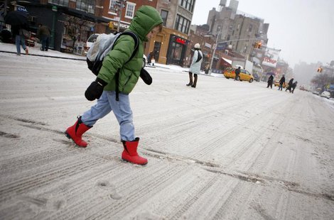A boy walks crosses a snow covered street on his way to school in New York, February 14, 2007. REUTERS/Eric Thayer A boy walks crosses a snow covered street on his way to school in New York, February 14, 2007. REUTERS/Eric Thayer