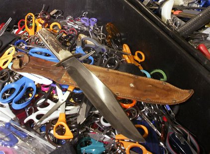 Knives, scissors and other prohibited items that were confiscated at the airport during security checks by Transportation Security Administr Knives, scissors and other prohibited items that were confiscated at the airport during security checks by Transportation Security Administr