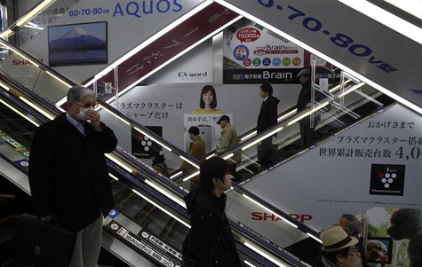 Advertisements for Sharp are seen at a train station in Tokyo March 6, 2013. Samsung Electronics Co is set to invest $110 million in Sharp C Advertisements for Sharp are seen at a train station in Tokyo March 6, 2013. Samsung Electronics Co is set to invest $110 million in Sharp C
