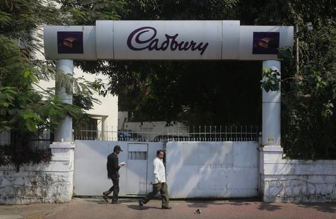 People walk on a pathway in front of the Cadbury India headquarters in Mumbai March 6, 2013. REUTERS/Danish Siddiqui People walk on a pathway in front of the Cadbury India headquarters in Mumbai March 6, 2013. REUTERS/Danish Siddiqui