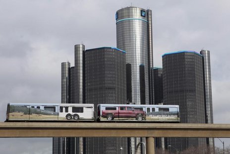 Two cars of the 'people mover' public rail are seen covered with a advertisement for the 2014 Chevy Silverado pickup truck as they move past Two cars of the 'people mover' public rail are seen covered with a advertisement for the 2014 Chevy Silverado pickup truck as they move past