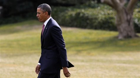 U.S. President Barack Obama walks on the South Lawn of the White House in Washington before departing to visit wounded military personnel at U.S. President Barack Obama walks on the South Lawn of the White House in Washington before departing to visit wounded military personnel at