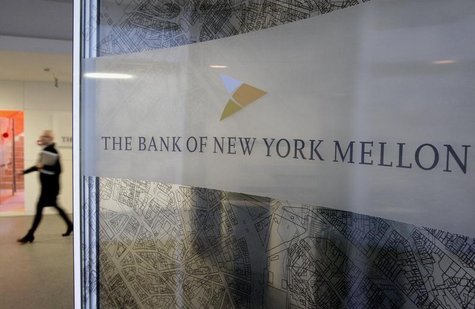 A woman walks past a logo at the office of the Bank of New York Mellon in Brussels, February 25, 2010. REUTERS/Sebastien Pirlet A woman walks past a logo at the office of the Bank of New York Mellon in Brussels, February 25, 2010. REUTERS/Sebastien Pirlet
