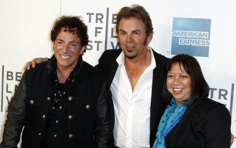 Neal Schon (L) and Jonathan Cain of the band Journey arrive with director Ramona Diaz for the premiere of "Don't Stop Believin': Everyman's Neal Schon (L) and Jonathan Cain of the band Journey arrive with director Ramona Diaz for the premiere of "Don't Stop Believin': Everyman's
