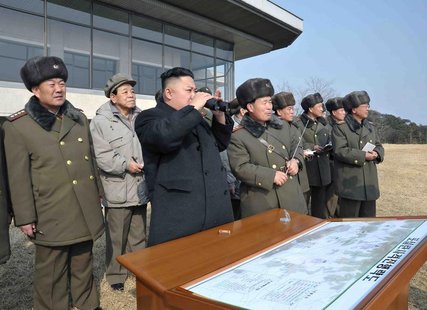 North Korean leader Kim Jong-Un (C) inspects an artillery firing drill of the Korean People's Army units in an undisclosed location in this North Korean leader Kim Jong-Un (C) inspects an artillery firing drill of the Korean People's Army units in an undisclosed location in this